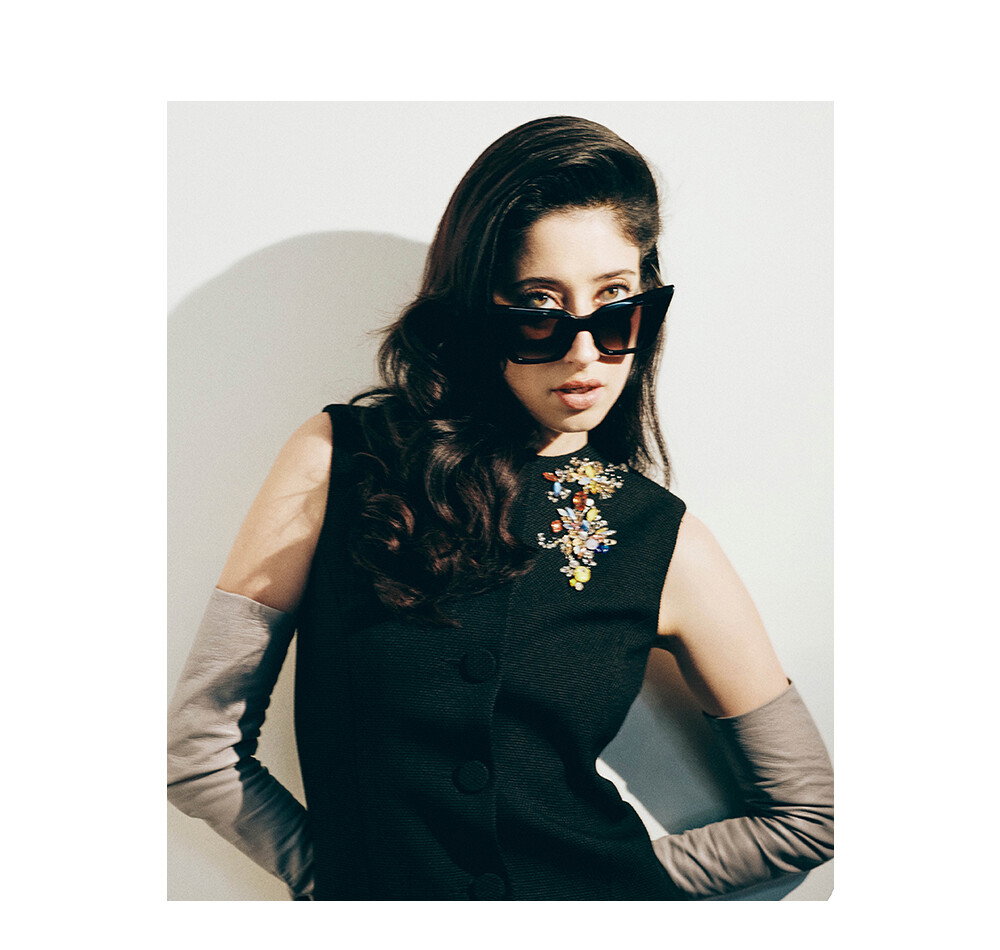 Influencer and actor Tanya Burr wearing The Maria 003 Cat-Eye Sunglass in Black.