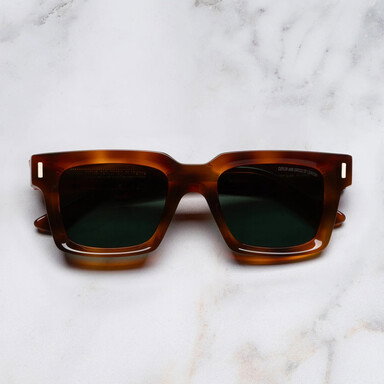 The 1386 Sunglass from Cutler and Gross is a classic square silhouette, in a warm Honey Havana colourway.