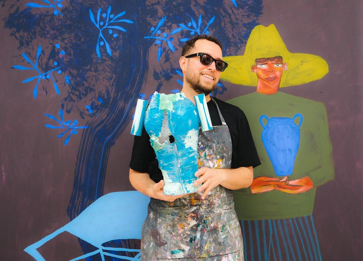 An Image of Jose Campos wearing the Cutler and Gross X The Great Frog Phantom Sunglasses in Black on Red.