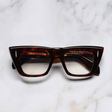 The Great Frog Love and Death Cat Eye Optical, with a sharp silhouette and Dark Turtle colourway.