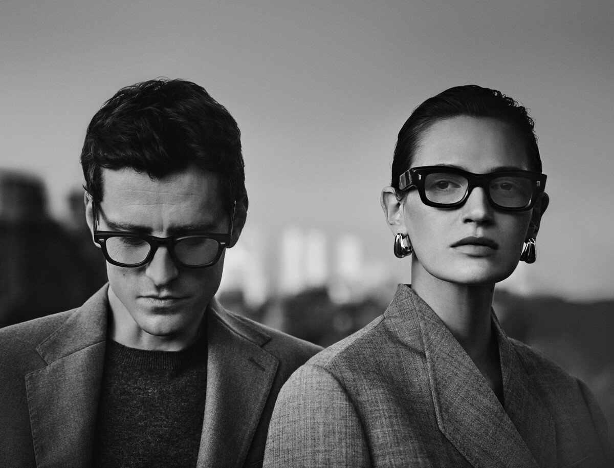 Black and white image of male and female wearing opticals.