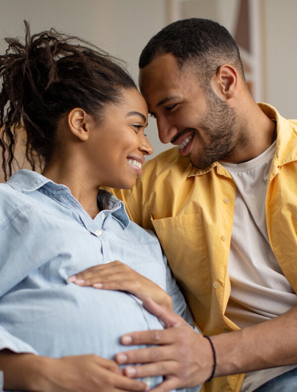 Image of a couple smiling at one another